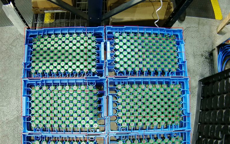 AI vision system counting items across multiple dunnage trays