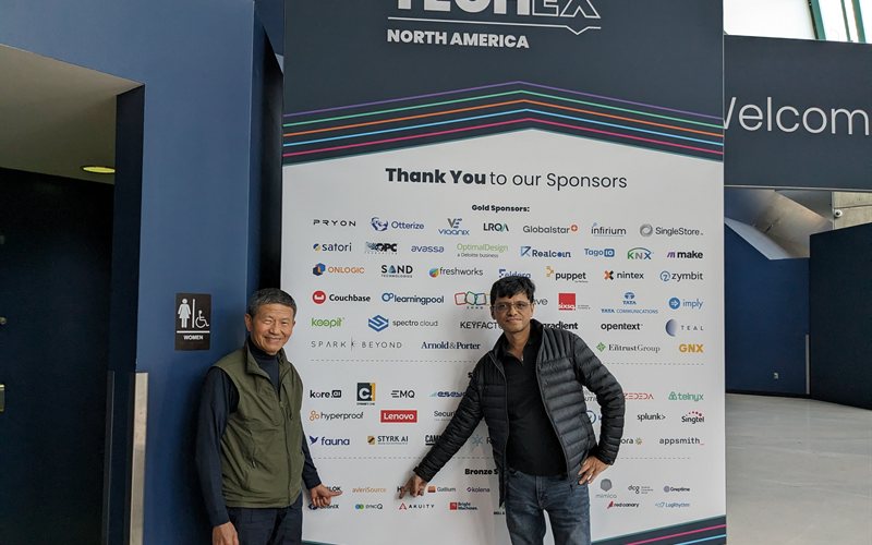 Team at TechEx North America sponsor wall